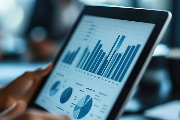 Tablet screen showing various charts and graphs related to an employee benefit plan audit