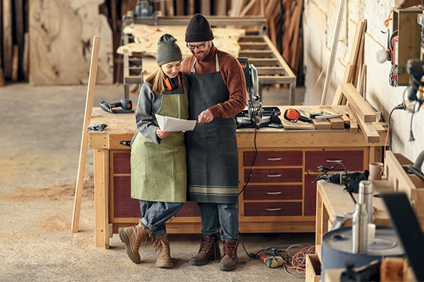 Shop Small sign hanging in a storefront, illustrating how outsourced accounting services support small business growth.